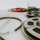 four reel films lying on white table