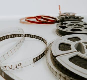 four reel films lying on white table