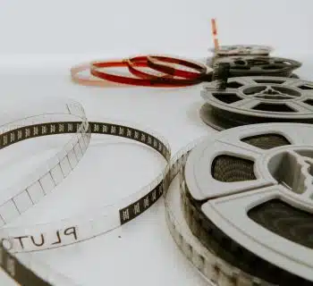 four reel films lying on white table